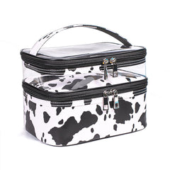 Imerelez cow print makeup bag top view showing organized, spacious interior for cosmetics.