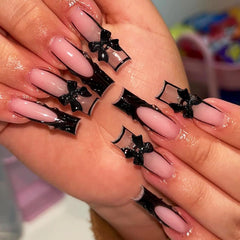 IMRAIN long square nails with black French tips and bow design for instant chic.