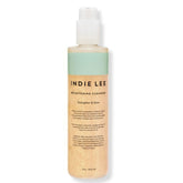 Indie Lee Brightening Facial Cleanser bottle close-up for radiant hydration.