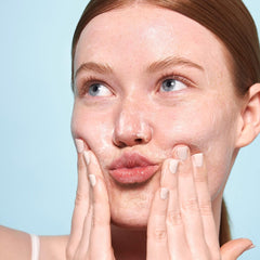 Indie Lee Brightening Cleanser pump application demonstrates gentle makeup removal.