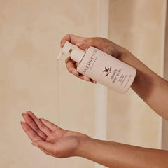 INNERSENSE Awaken Body Wash pump bottle showing creamy lather for gentle cleansing