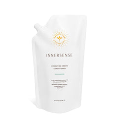 INNERSENSE Natural Hydrating Cream Conditioner bottle close-up for deep moisture and frizz control.