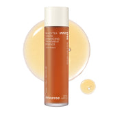 Innisfree Black Tea Youth Essence bottle close-up highlighting hydration and radiance.