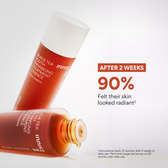 Innisfree Black Tea Youth Essence drops on hand before applying.