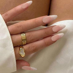 IQXGE silver glitter French tips on almond nails add subtle luxury