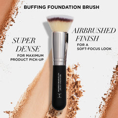 IT Cosmetics brush in hand shows ergonomic soft-touch handle for quick blending.