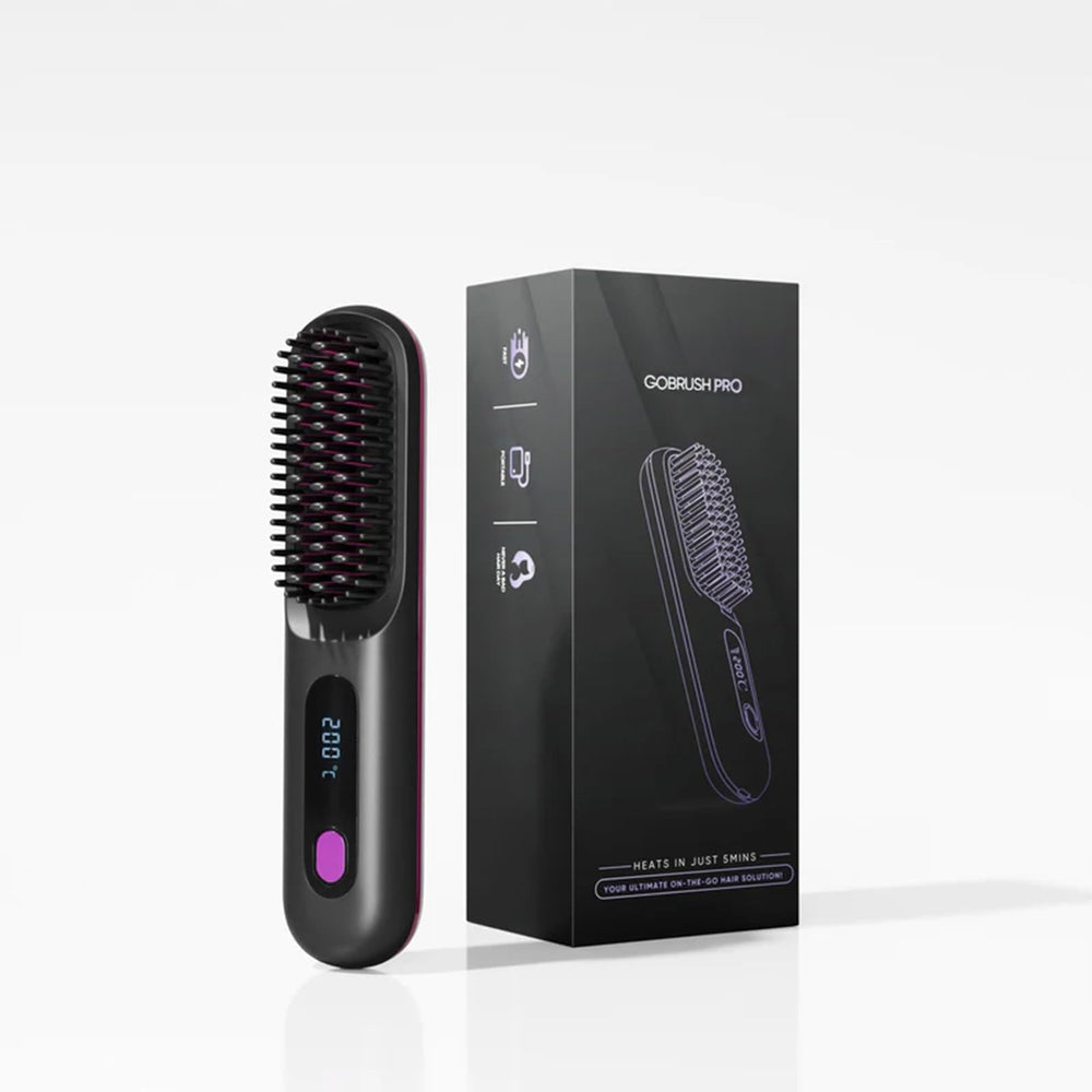 IZRIO Go Brush Pro 2025 in hand for on-the-go styling convenience.
