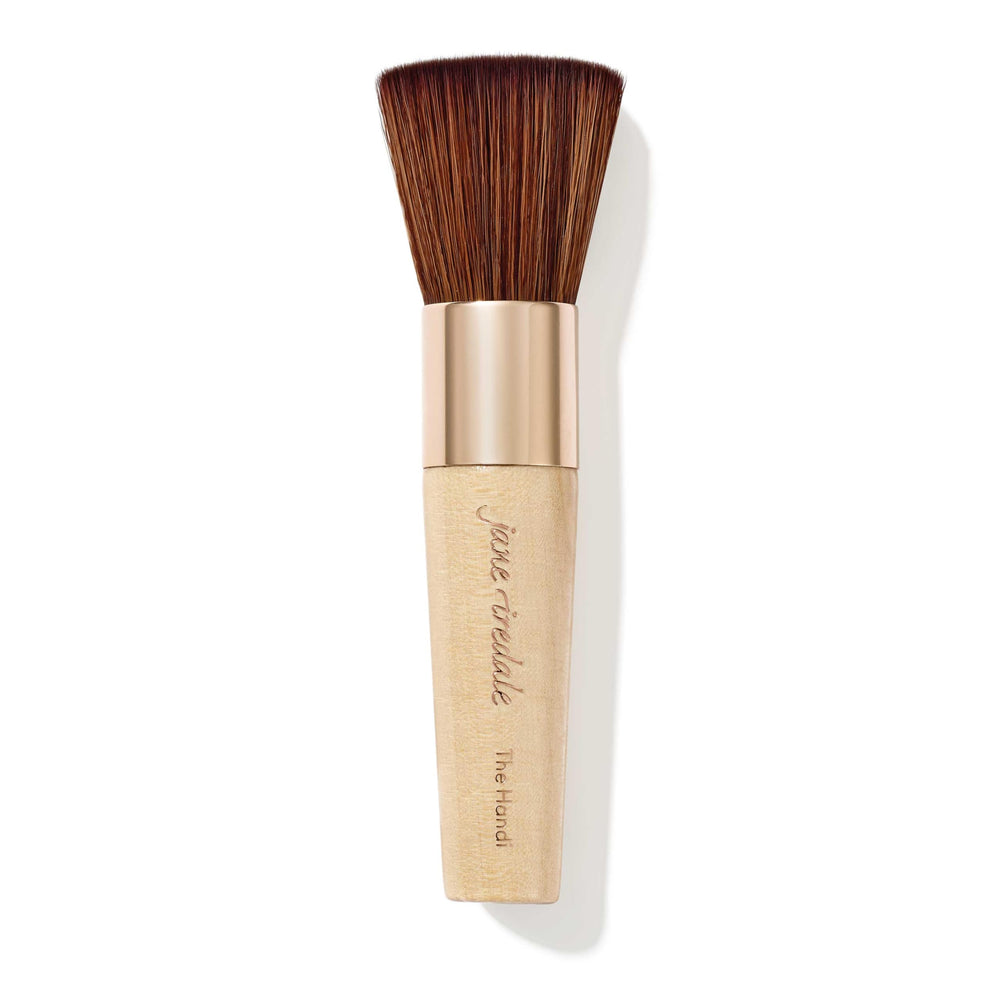 jane iredale The Handi Brush with rose-gold handle supports precise powder application.