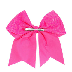 Jeffan bright-pink bow with alligator-clip close-up showing secure grip