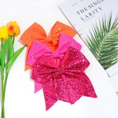 Jeffan bright pink bow worn on ponytail demonstrates two-layer design