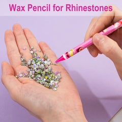 JINJINANV sharpened wax pencil tip ready for precise rhinestone dotting.