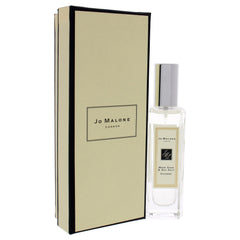 Jo Malone Wood Sage & Sea Salt spray bottle in use, effortless layering potential.