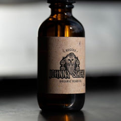 Johnny Slicks organic beard oil dropper ready for precise application