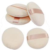 Puff Joly para polvo facial, aplicación suave y uniforme.