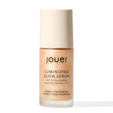 Jouer Luminizing Glow Drops bottle closeup showing lightweight dewy glow