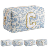 JOVAKIT Alphabet Makeup Bag blue floral front view for travel-ready cosmetics storage.