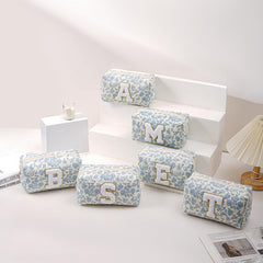 JOVAKIT blue floral bag shown open with makeup tools neatly organized.