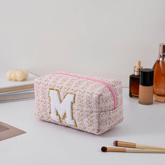 JOVAKIT pink floral travel pouch with zipper for cosmetics on the go.