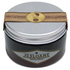 JS Sloane Heavy Weight Brilliantine pomade jar close-up for strong hold and glossy finish.