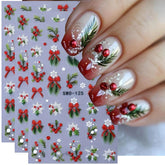 JUGGSSA Christmas nail stickers show holly bow and snowflake for quick festive manicures.