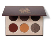 Juvia's Place The Chocolates palette closeup pan shows rich pigment for bold lids.