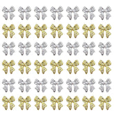 KACHIMOO bow nail charms gold closeup adds chic detail to nails.