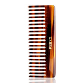 KAHEM wide tooth detangler comb held in hand for gentle scalp massage and frizz control.