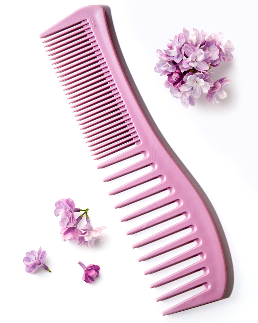 Keranique detangling comb wide-tooth for even conditioner distribution and knot-free styling.