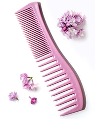Keranique detangling comb wide-tooth for even conditioner distribution and knot-free styling.