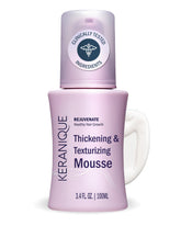Keranique volumizing mousse bottle on vanity offers instant volume and soft hold.