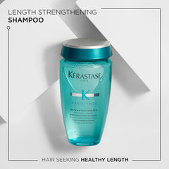 KÉRASTASE Bain Extentioniste shampoo lather close-up for scalp cleansing and root support.