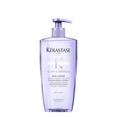 Kerastase Blond Absolu Lumière shampoo bottle shows hydrating, luminous formula for highlighted hair.
