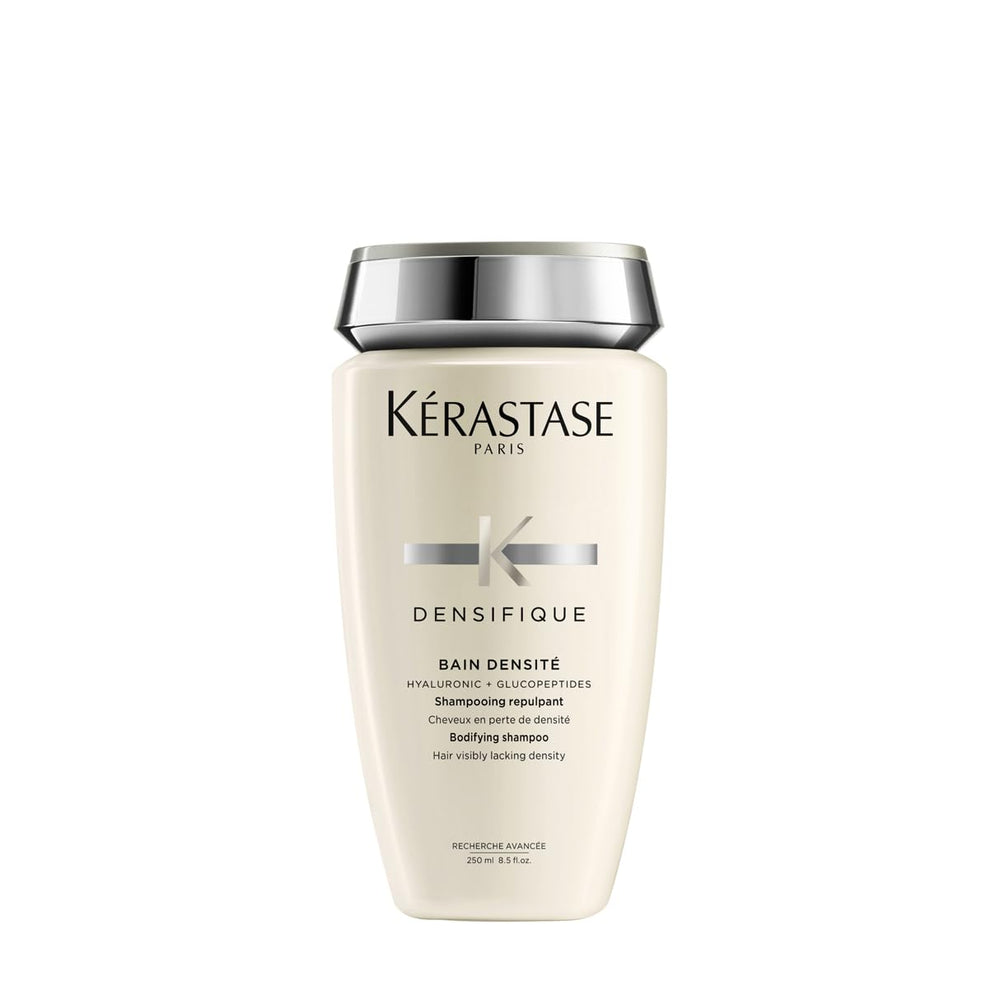 KÉRASTASE Densifique shampoo bottle promotes thicker hair appearance.