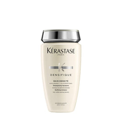 KÉRASTASE Densifique shampoo bottle promotes thicker hair appearance.