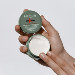 KÉRASTASE Genesis Homme label highlights creatine-ginger-root formula boosting hair strength