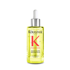 KÉRASTASE Première Repairing Gloss Oil bottle highlights fortifying shine-enhancing formula.