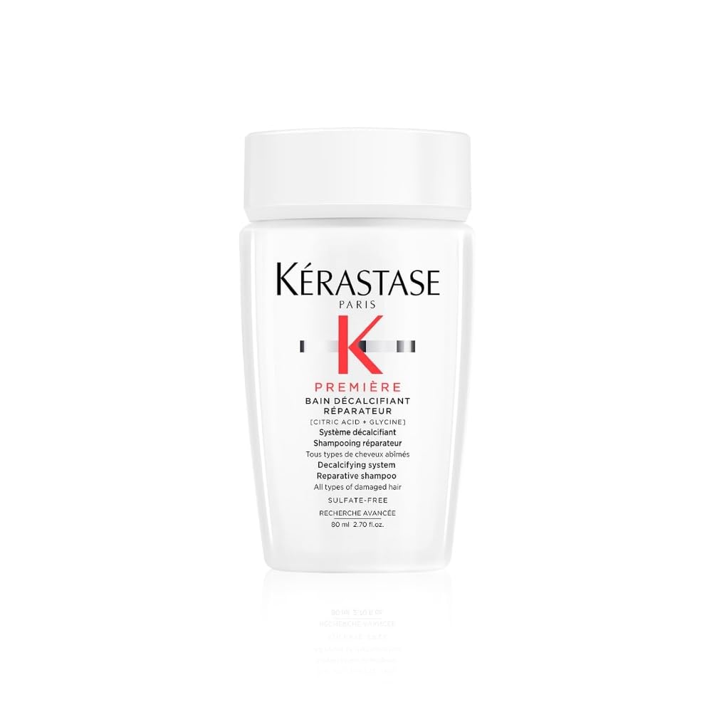 KÉRASTASE Première sulfate-free shampoo bottle demonstrates dual-action cleansing for stronger hair.