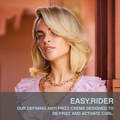 KEVIN.MURPHY EASY.RIDER hands applying cream for flexible hold and nourishment.