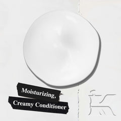 Kiehl's Amino Acid Conditioner label closeup highlights nourishing ingredients like amino acids and coconut oil.