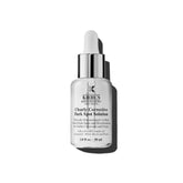 Kiehl's Clearly Corrective serum bottle on a clean surface for brightening skin.