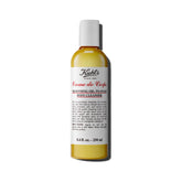 Kiehl's Creme de Corps bottle-pour shows gentle cleansing for soft, nourished skin.