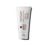 Kiehl's Epidermal Re-Texturizing Scrub jar shows exfoliation benefits on skin.