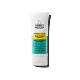 Kiehl's Expertly Clear moisturizer bottle closeup showing acne-fighting formula for clearer skin.