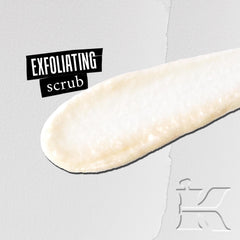 Kiehl's scrub in palm demonstrates application and gentle exfoliation.
