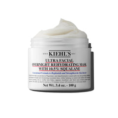 Kiehl's Ultra Facial Overnight Mask bottle pour shows premium hydration for overnight use.