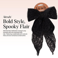 Kitsch black ribbon hair clip worn on ponytail demonstrates secure hold for active days