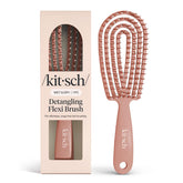 Kitsch Detangler Brush bendable frame for gentle detangling and head-shape adaptation.