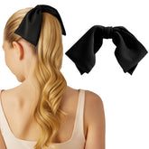 Kitsch oversized hair bow black close-up showing sustainable fabric and bow shape for daily elegance
