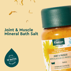 Kneipp Arnica bath salt close-up shows the vibrant saffron color enhancing a soothing soak.