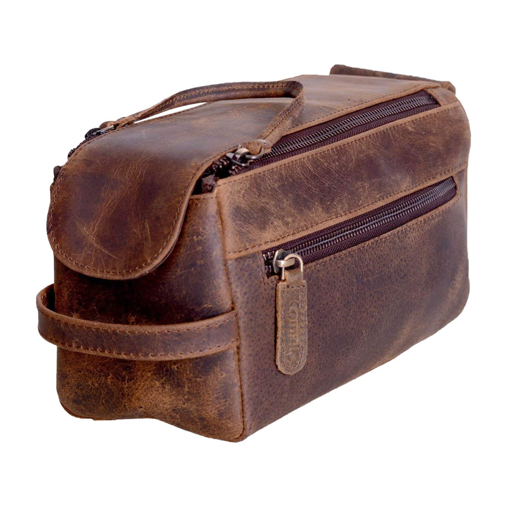 KomalC premium buffalo leather Dopp bag close-up shows durable travel companion.